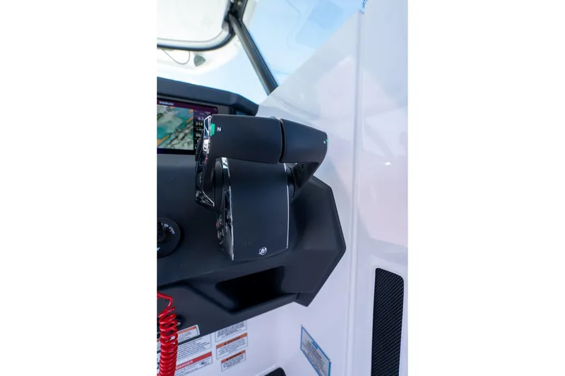 Slide: The Image of Control panel of 2025 Axopar CCX Center Console with audio and wiper controls. - 26