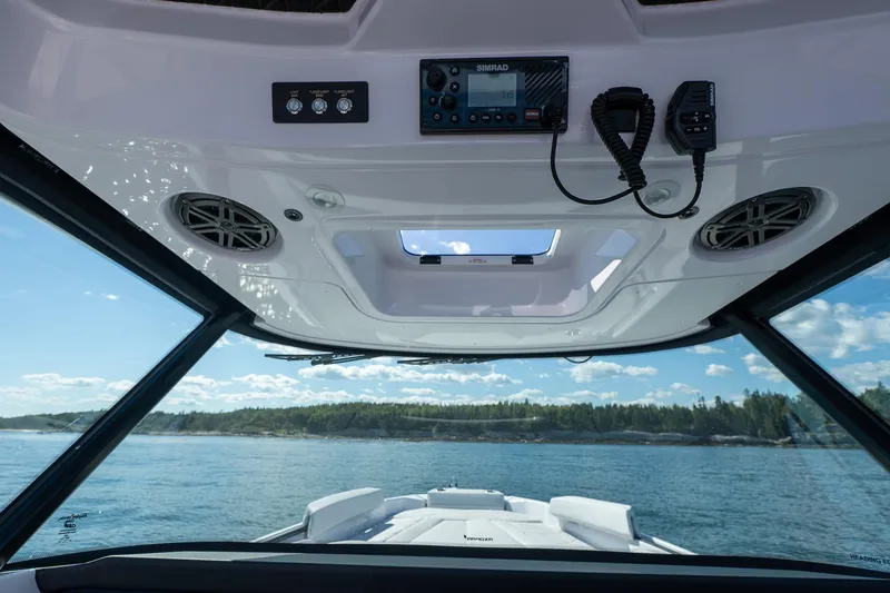 Slide: The Image of 2025 Axopar CCX Center Console throttle controls and dashboard display. - 27
