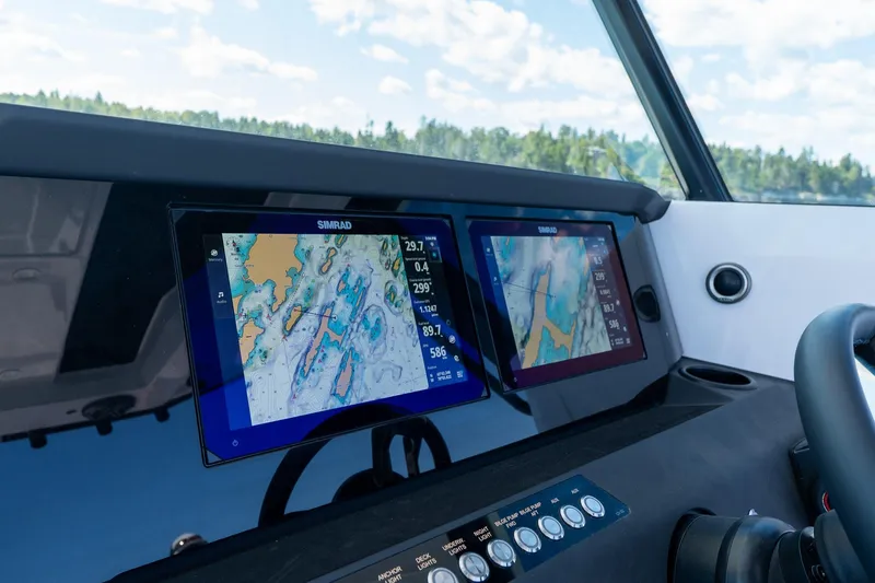 Slide: The Image of Interior view of 2025 Axopar CCX Center Console boat with ocean and sky in background. - 28