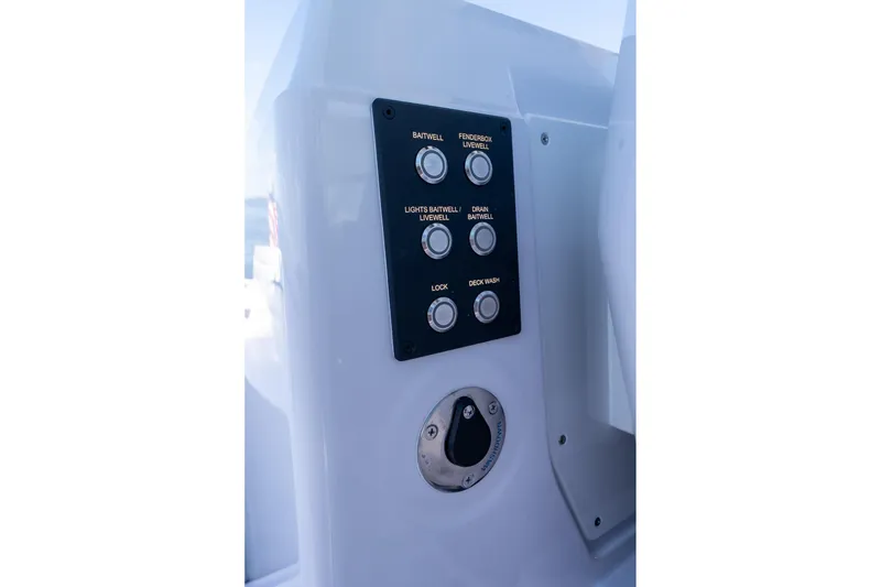 Slide: The Image of 2025 Axopar CCX Center Console boat interior with luxurious seating and steering wheel. - 30