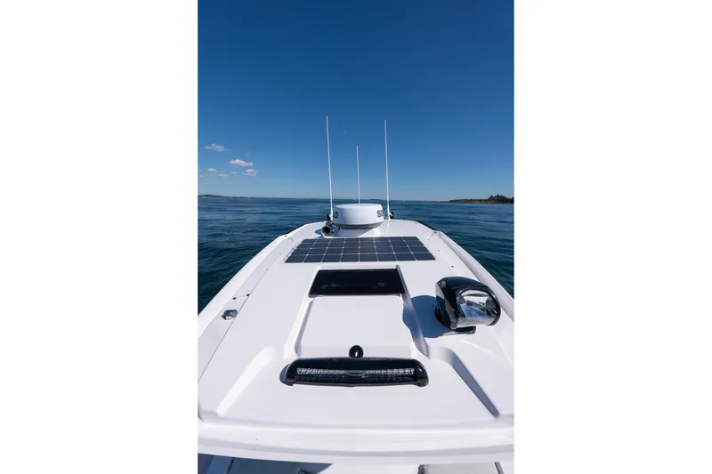 Slide: The Image of 2025 Axopar CCX Center Console boat with advanced radar and LED light bar. - 39