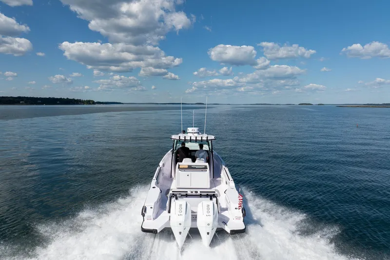 Slide: The Image of Overhead view of 2025 Axopar CCX Center Console boat on water. - 8