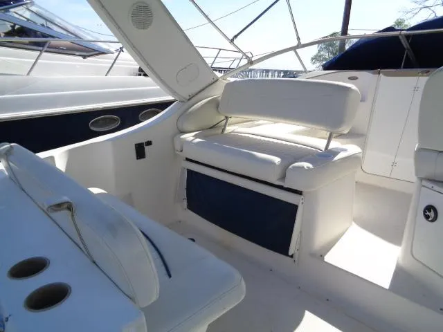 Slide: The Image of 2002 Bayliner 2855 Ciera boat interior with white seating and storage compartments. - 10