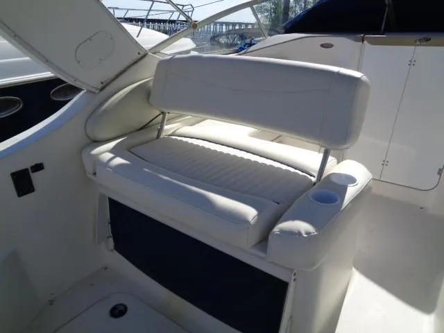 Slide: The Image of 2002 Bayliner 2855 Ciera boat interior with white seating and cup holders. - 11