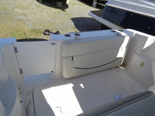 Slide: The Image of 2002 Bayliner 2855 Ciera boat interior with white seating and cup holders. - 12