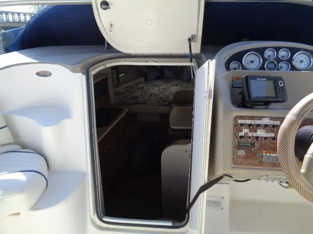 Slide: The Image of 2002 Bayliner 2855 Ciera cabin entrance with dashboard and navigation equipment. - 13