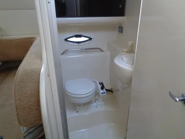 Slide: The Image of 2002 Bayliner 2855 Ciera boat bathroom with toilet and sink. - 24