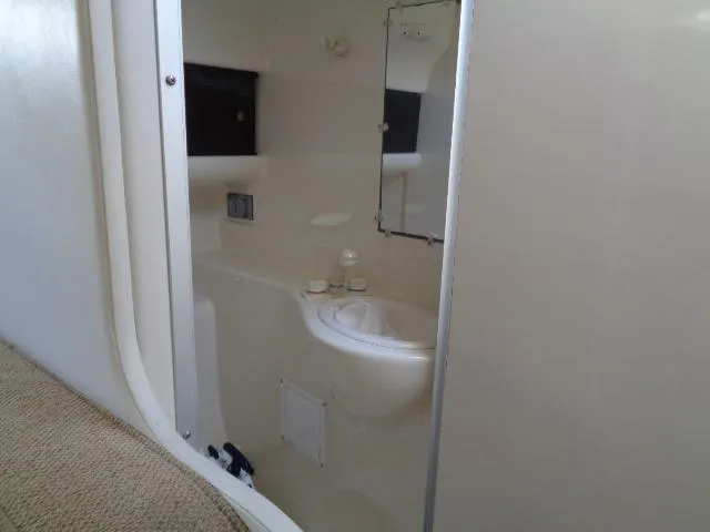 Slide: The Image of 2002 Bayliner 2855 Ciera boat interior bathroom with sink and mirror. - 25