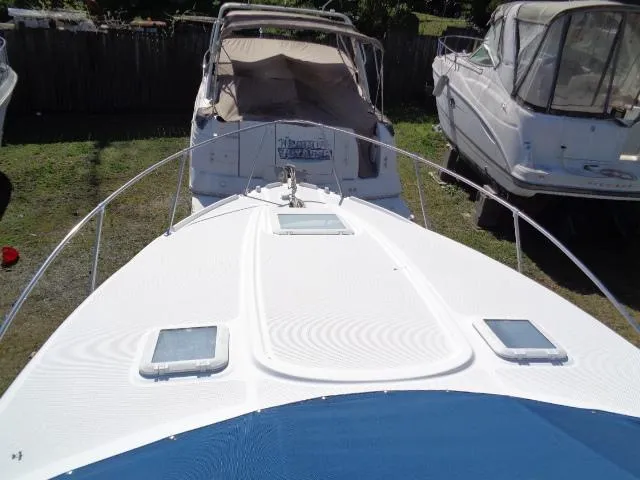 Slide: The Image of 2002 Bayliner 2855 Ciera boat docked with other vessels in a marina. - 4