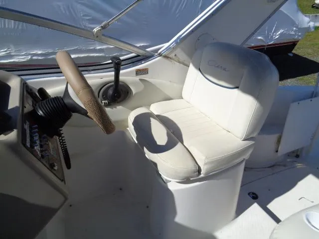 Slide: The Image of 2002 Bayliner 2855 Ciera cockpit with steering wheel and white captain's chair. - 6