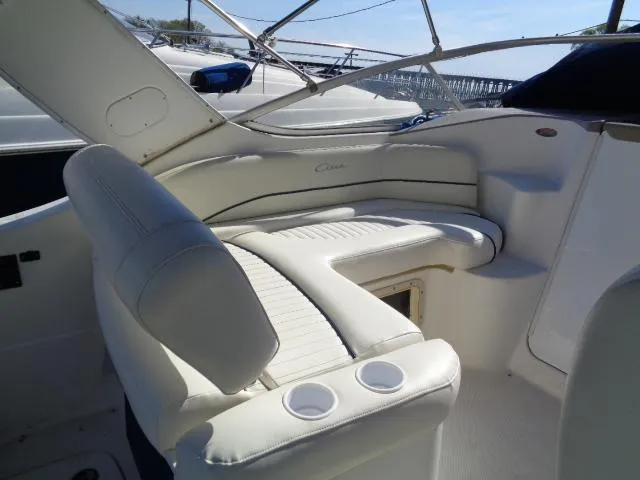 Slide: The Image of 2002 Bayliner 2855 Ciera boat interior with white seating and cup holders. - 7