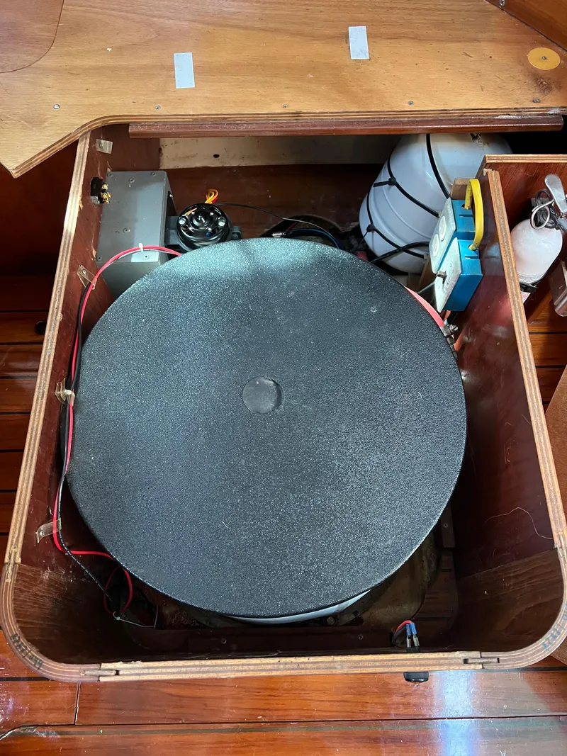 Slide: The Image of Beneteau Oceanis 440 (1994) interior compartment with equipment and storage. - 12