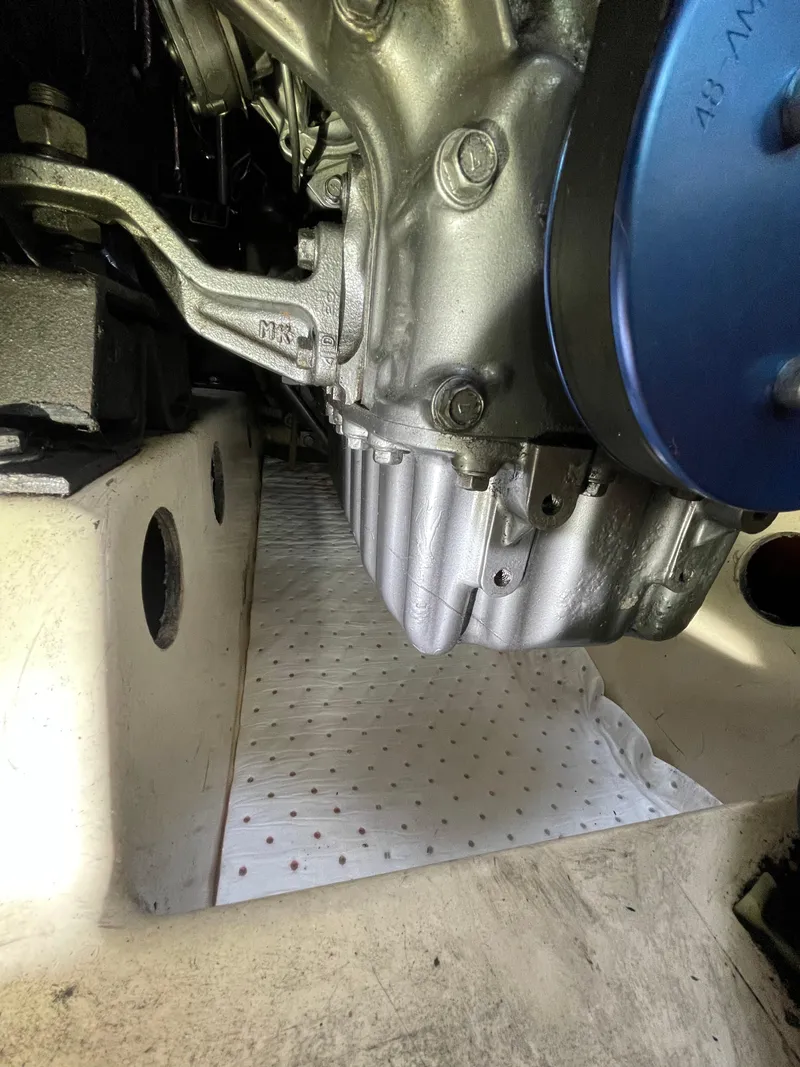 Slide: The Image of Engine compartment of a 1994 Beneteau Oceanis 440 sailboat, showcasing mechanical components. - 18