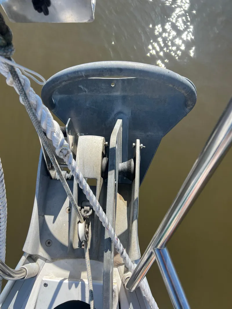 Slide: The Image of Bow of 1994 Beneteau Oceanis 440 sailboat with anchor and ropes. - 2