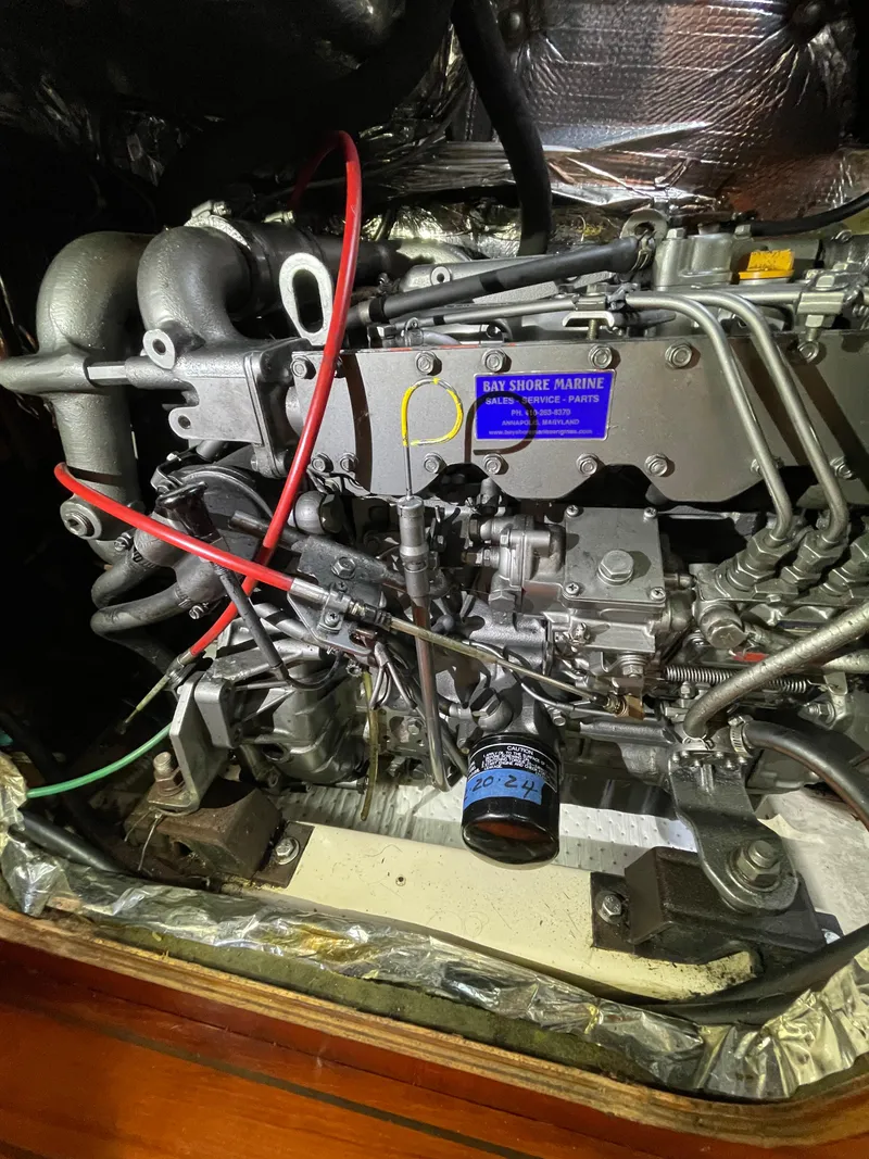 Slide: The Image of Engine of a 1994 Beneteau Oceanis 440 sailboat, detailed view with visible components. - 23