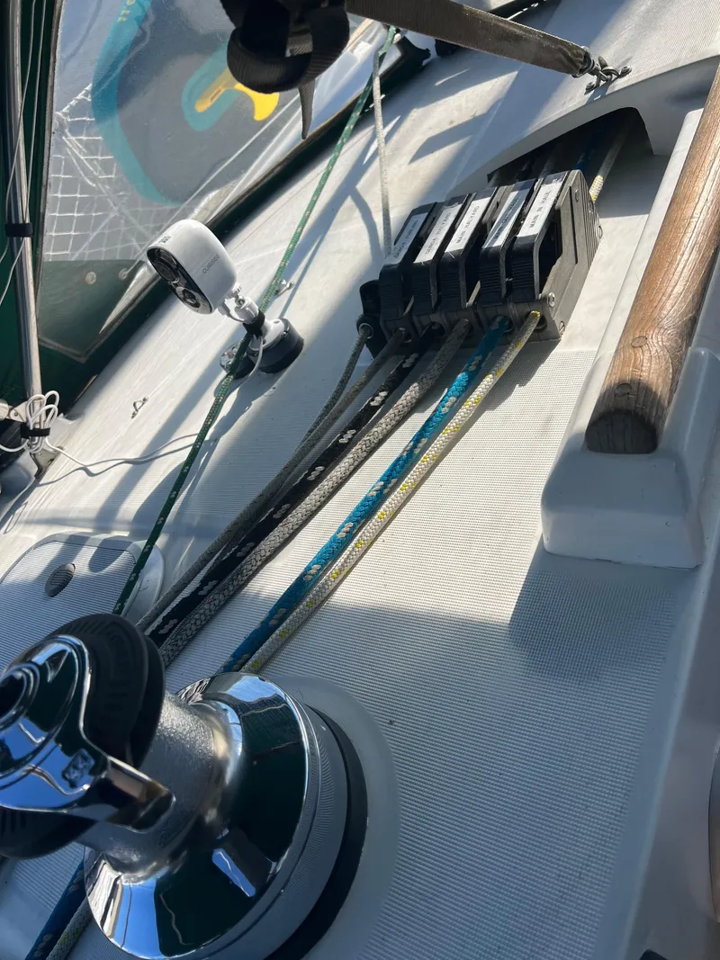 Slide: The Image of Deck of 1994 Beneteau Oceanis 440 sailboat with winch and rope clutches. - 26