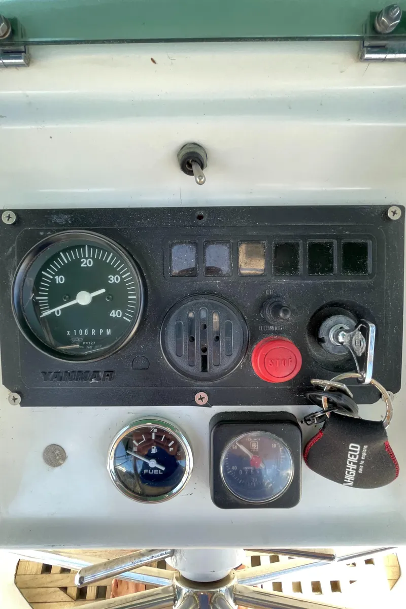 Slide: The Image of Control panel of a 1994 Beneteau Oceanis 440 sailboat with gauges and ignition key. - 41