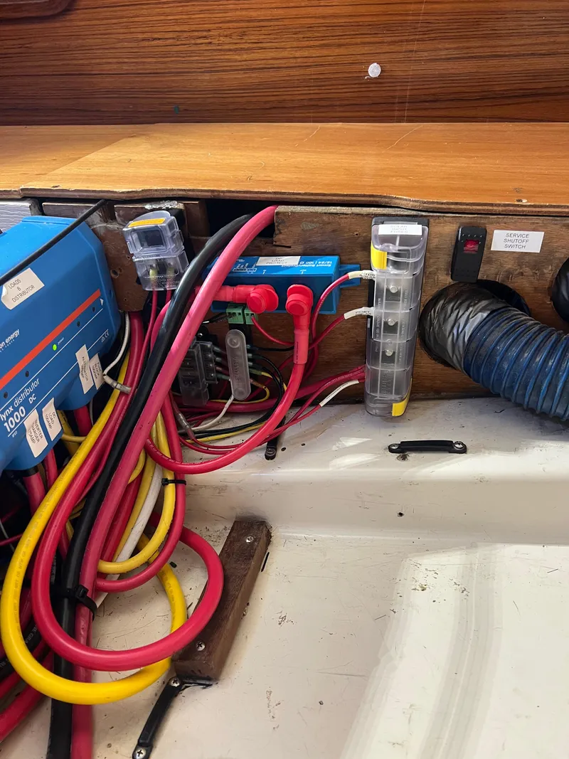 Slide: The Image of Electrical wiring and components inside a 1994 Beneteau Oceanis 440 sailboat. - 43