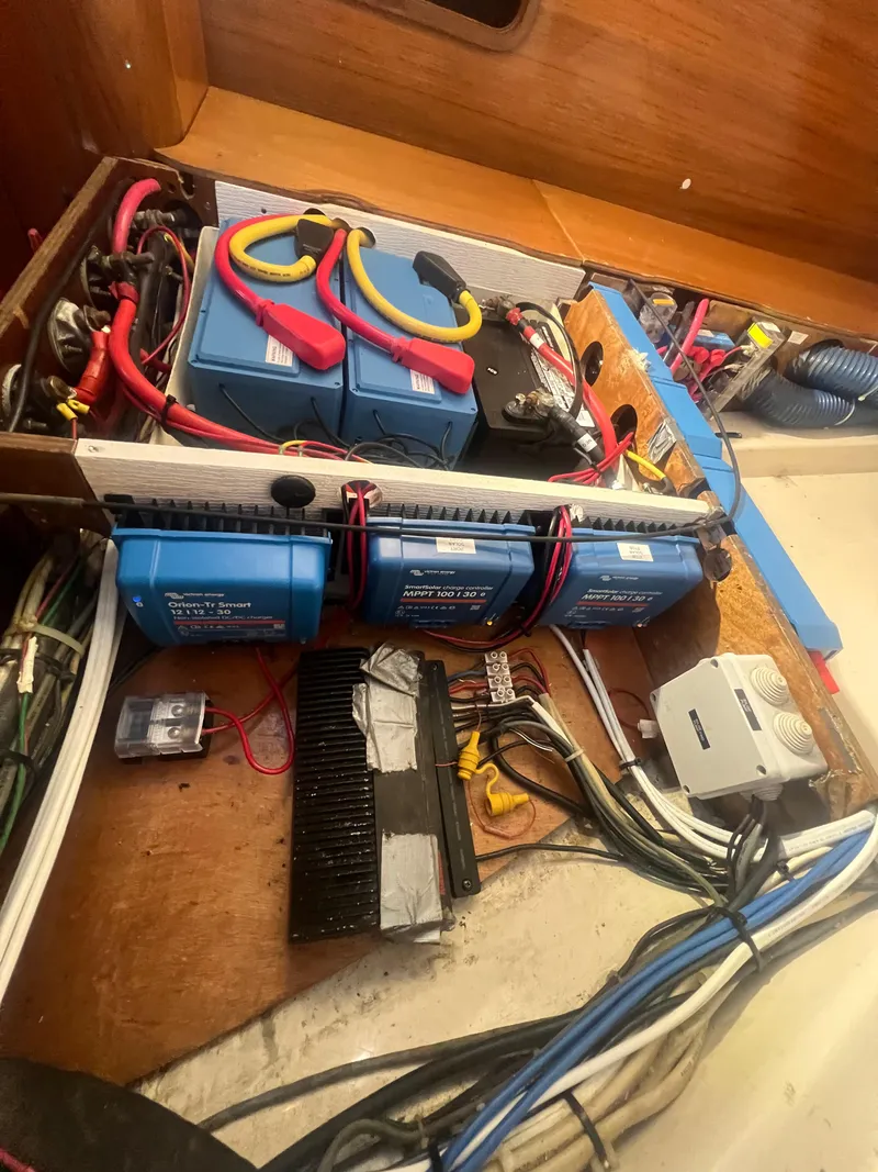 Slide: The Image of Electrical system of a 1994 Beneteau Oceanis 440 sailboat, featuring batteries and wiring. - 45
