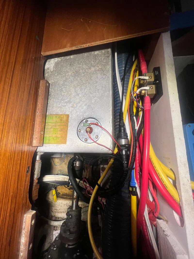 Slide: The Image of Electrical wiring and components inside a 1994 Beneteau Oceanis 440 sailboat. - 46
