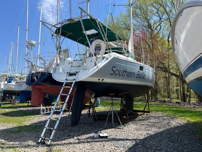 Slide: The Image of 1994 Beneteau Oceanis 440 sailboat "Southern Belle" on land with ladder access. - 9