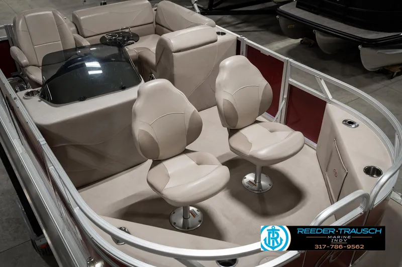 Slide: The Image of 2019 Avalon Eagle boat interior with beige seating and steering console. - 13