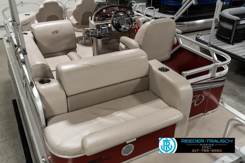 Slide: The Image of 2019 Avalon Eagle boat interior with beige seating and steering console. - 15
