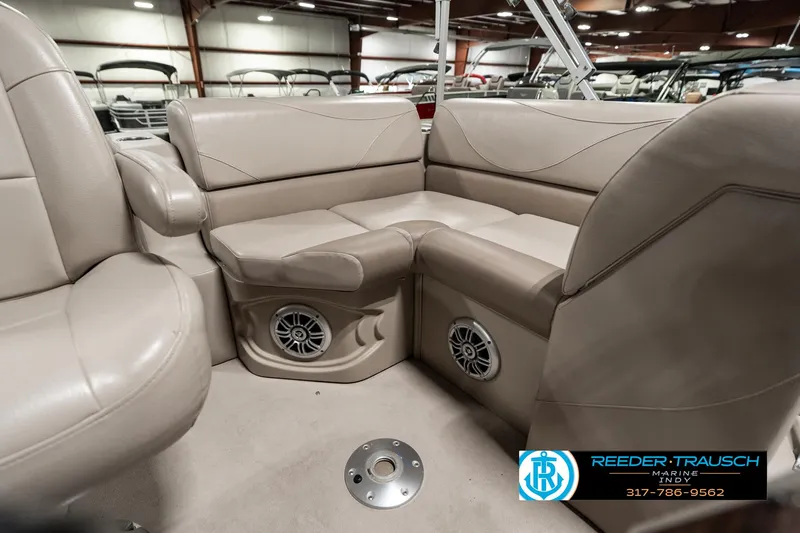 Slide: The Image of Luxurious 2019 Avalon Eagle boat interior with beige seating and built-in speakers. - 21