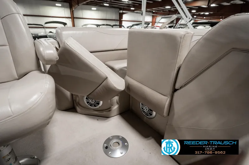 Slide: The Image of 2019 Avalon Eagle boat interior with beige seating and speaker system. - 22