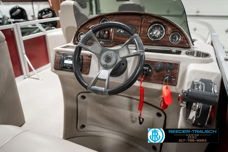 Slide: The Image of 2019 Avalon Eagle boat dashboard with steering wheel and control panel. - 25