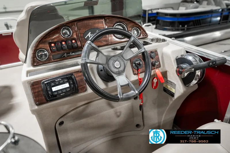 Slide: The Image of 2019 Avalon Eagle boat dashboard with steering wheel and control panel. - 26