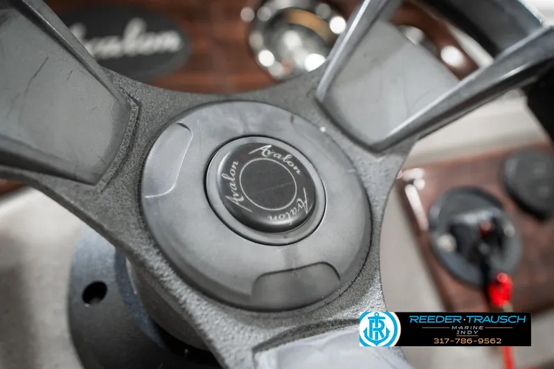 Slide: The Image of Steering wheel of 2019 Avalon Eagle boat with Reeder-Trausch Marine logo. - 27