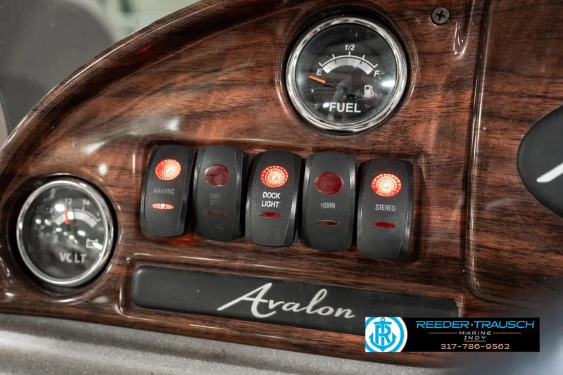 Slide: The Image of Dashboard of 2019 Avalon Eagle with fuel gauge and control switches. - 29