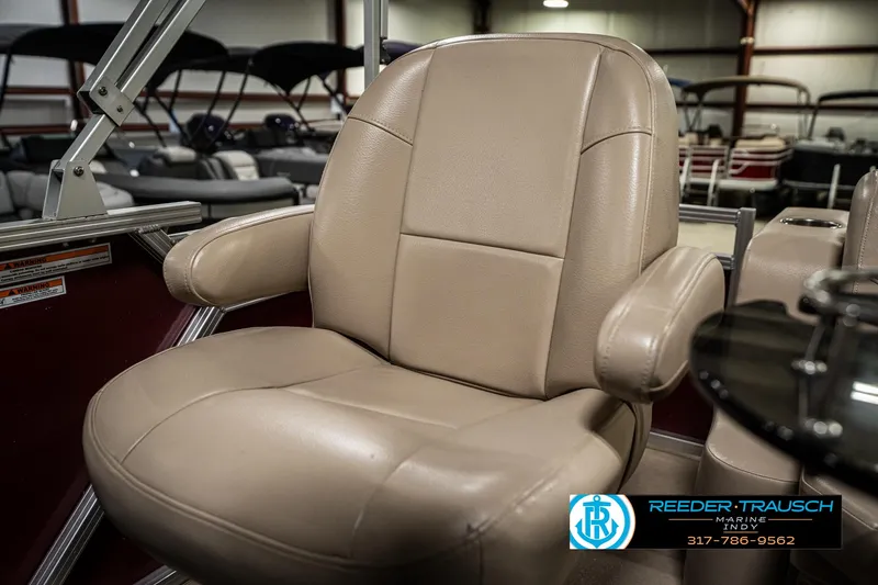 Slide: The Image of Beige captain's chair in 2019 Avalon Eagle boat, showroom setting. - 32