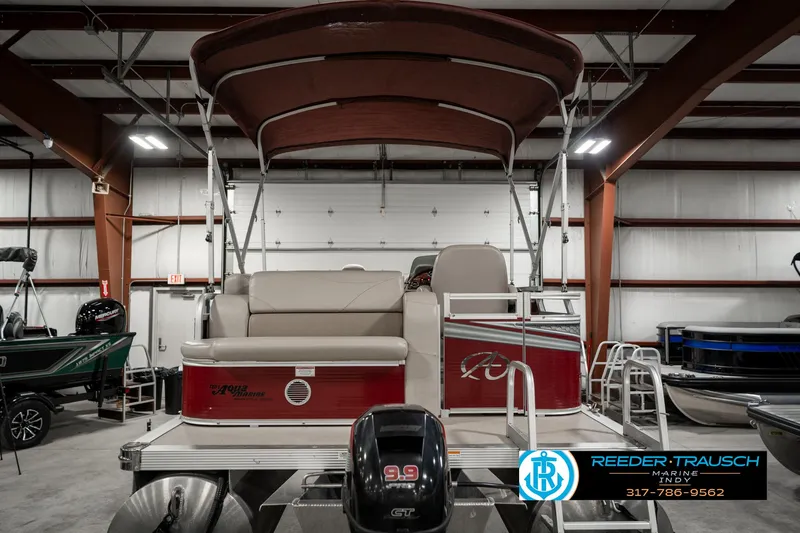 Slide: The Image of 2019 Avalon Eagle pontoon boat with canopy in indoor showroom. - 9