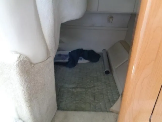 Slide: The Image of 2001 Regal Commodore 2760 interior cabin with carpet and storage area. - 20