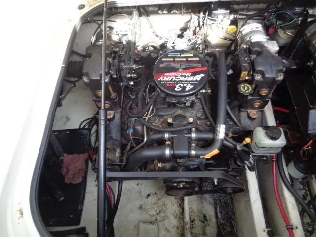 Slide: The Image of Engine compartment of a 2001 Regal Commodore 2760 boat, featuring a 4.3L MerCruiser engine. - 24