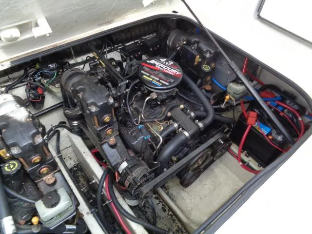 Slide: The Image of Engine compartment of a 2001 Regal Commodore 2760 boat, featuring a 4.3L MerCruiser engine. - 25