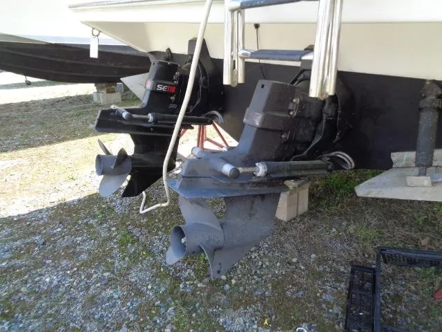 Slide: The Image of 2001 Regal Commodore 2760 boat stern with dual propellers on dry land. - 27