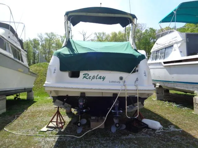 Slide: The Image of 2001 Regal Commodore 2760 boat on land, covered, with surrounding boats. - 5