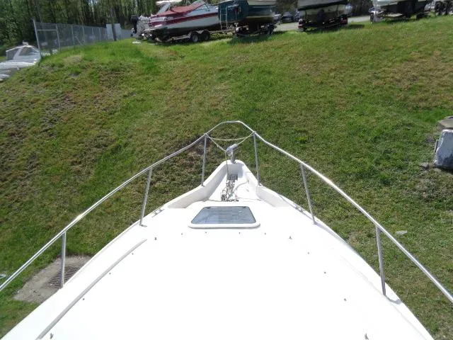 Slide: The Image of Bow view of 2001 Regal Commodore 2760 boat on grassy terrain. - 7