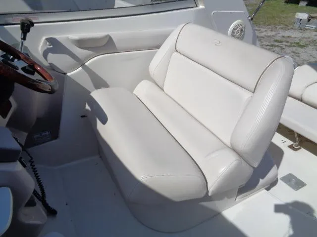 Slide: The Image of 2001 Regal Commodore 2760 boat interior with white leather seating. - 9