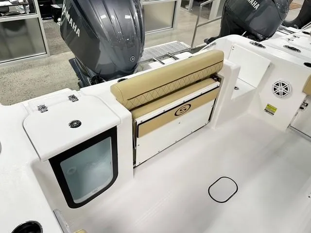 Slide: The Image of 2025 Sportsman Open 232 Center Console boat interior with seating and storage. - 11
