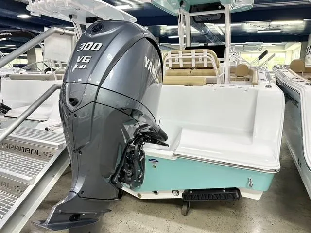 Slide: The Image of 2025 Sportsman Open 232 Center Console with Yamaha 300 V6 engine in showroom. - 15