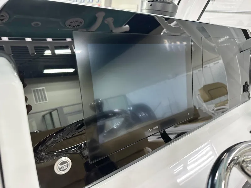 Slide: The Image of 2025 Sportsman Open 232 Center Console dashboard with Garmin display screen. - 3
