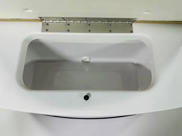 Slide: The Image of 2025 Sportsman Open 232 Center Console livewell with stainless steel hinge. - 9