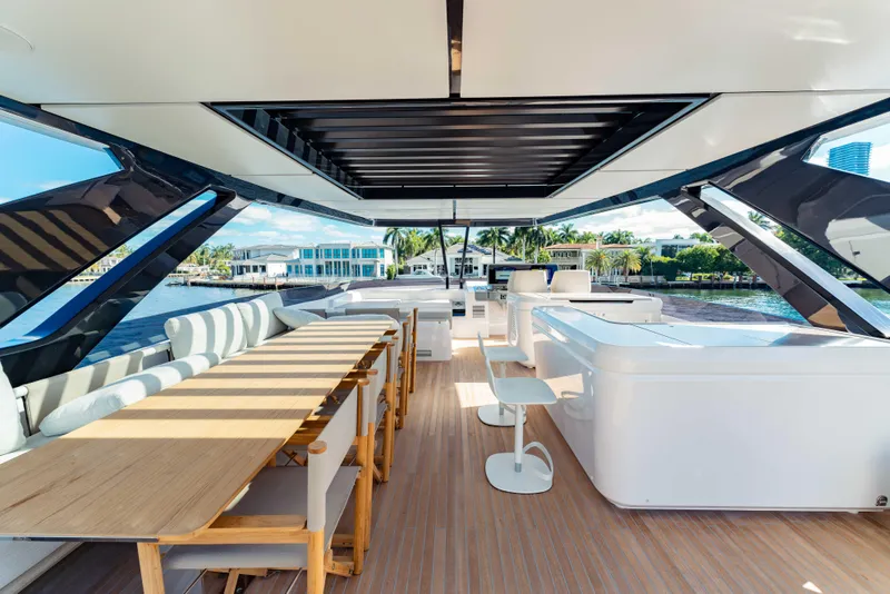 Slide: The Image of Luxurious 2023 Ferretti Yachts 860 interior with elegant seating and dining area. - 22