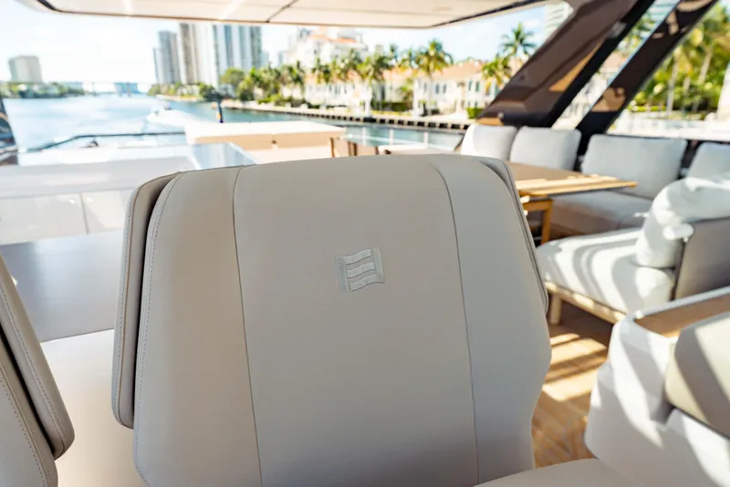 Slide: The Image of Luxurious interior of 2023 Ferretti Yachts 860, featuring elegant seating and scenic waterfront view. - 26
