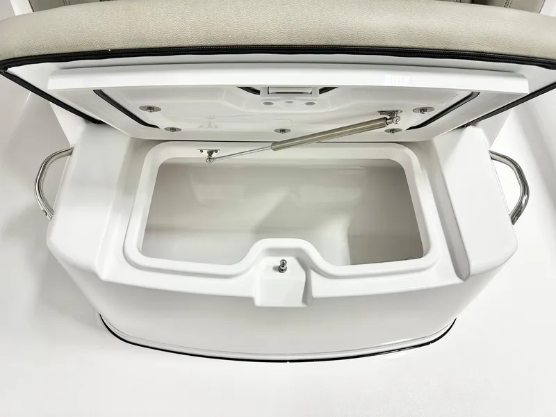 Slide: The Image of Open storage compartment on 2025 Sportsman Open 302 Center Console boat. - 10