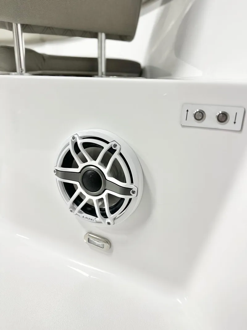 Slide: The Image of 2025 Sportsman Open 302 Center Console boat speaker and control panel. - 11